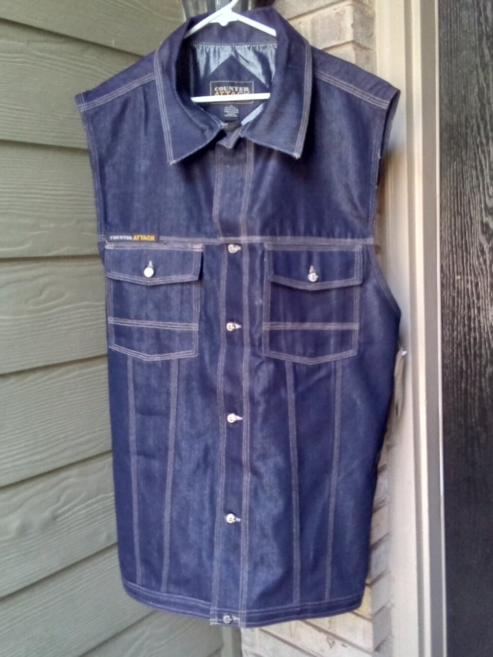 The product is a vintage 1984 Counter Attack denim vest in size XXL